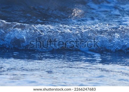 India, 30 November, 2023 : Blue ocean wave splashing on the beach. Sea wave.
