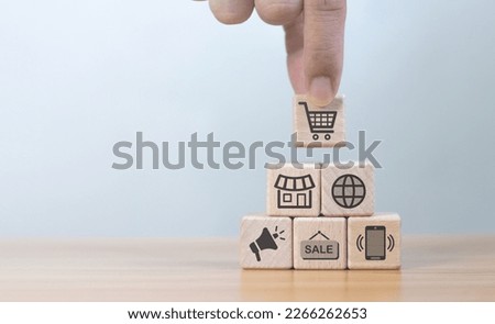 Online shopping concept with online business icon on wooden cube