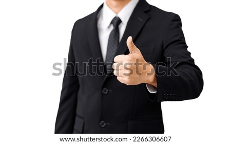 Business man in black suit thumbs up on isolated white background
