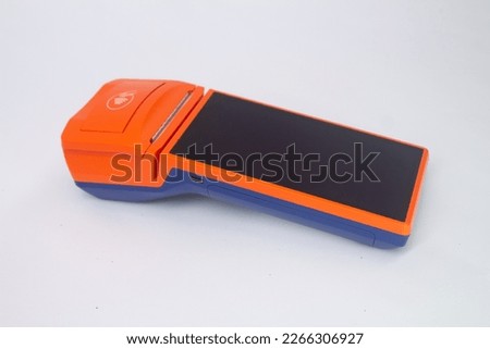 Close up photo of card payment wireless POS terminal isolated on white background. Cashless technology and banking concept. Shopping and contactless payments.