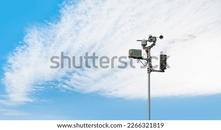 Weather station automatic measurement of weather parameters with cloudy sky Royalty-Free Stock Photo #2266321819