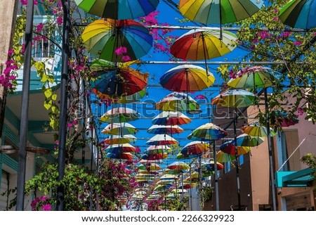 A view up Umbrella Street in Puerto Plata in the Dominion Republic on a bright sunny day Royalty-Free Stock Photo #2266329923