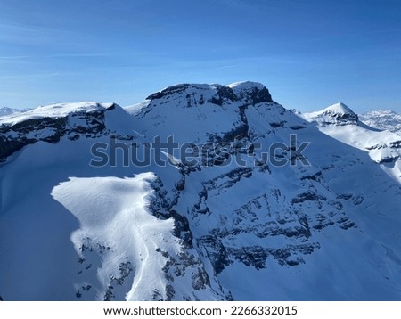 Snowy alpine mountain peaks Le Sommet des Diablerets and Tête Ronde located in the mountain massif Les Diablerets (Rochers or Scex de Champ) - Canton of Vaud, Switzerland (Suisse - Schweiz)