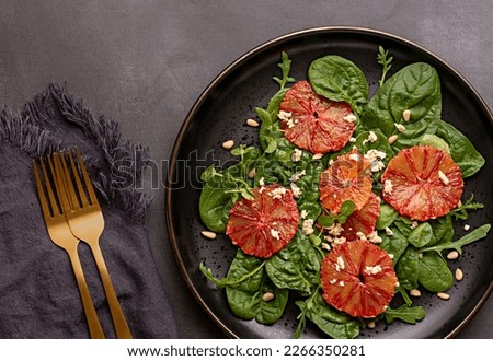 Food photography of salad with red orange, feta, spinach, arugula, pine nuts, vegetable, homemade, rocket