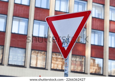 Yield red triangle travel road street sign