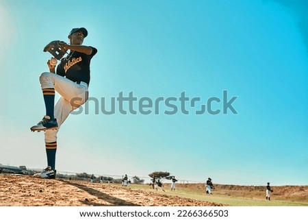 Get ready. Shot of a young baseball player pitching the ball during a game outdoors.