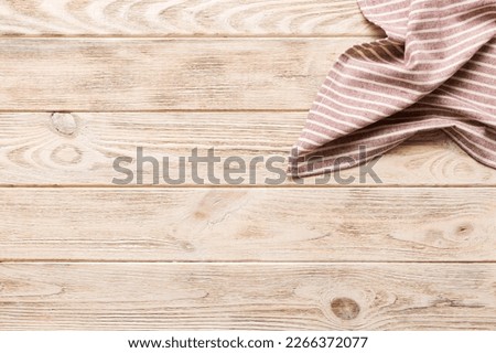 top view with red empty kitchen napkin isolated on table background. Folded cloth for mockup with copy space, Flat lay. Minimal style. Royalty-Free Stock Photo #2266372077