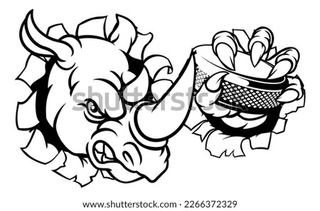 A rhino ice hockey player animal sports mascot holding a puck
