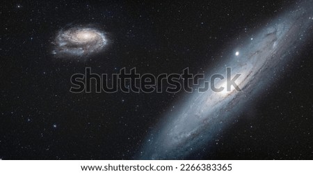 Andromeda galaxy with our galaxy is Milky Way in the  background "Elements of this image furnished by NASA "