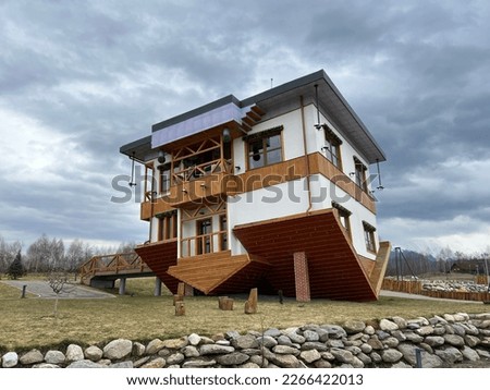 Upside down house museum on a cloudy day Royalty-Free Stock Photo #2266422013