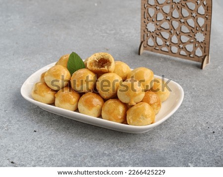 nastar or pineapple tart cookies on plate with the crunchy taste and soft pineapple jam filling, nastar will cheer up family in togetherness. its mandatory every eid mubarok day. selected focus  Royalty-Free Stock Photo #2266425229
