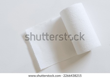 Toilet paper roll on white background. Royalty-Free Stock Photo #2266438215