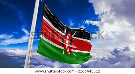 Kenya national flag cloth fabric waving on beautiful blue sky.