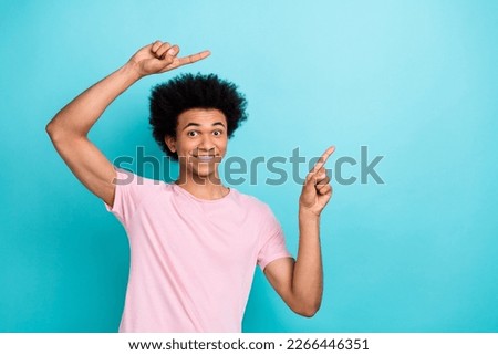 Photo of satisfied promoter banner opening new big amusement park entertainment direct fingers mockup young guy isolated on blue color background