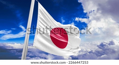 Japan national flag cloth fabric waving on beautiful blue sky. Royalty-Free Stock Photo #2266447253
