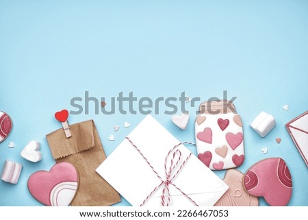 Composition with tasty cookies, marshmallows and envelope on color background. Valentine's Day celebration