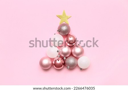Christmas tree made of beautiful balls on pink background