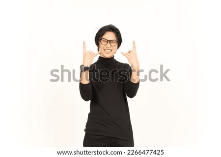 Showing Metal Hand Sign Of Handsome Asian Man Isolated On White Background