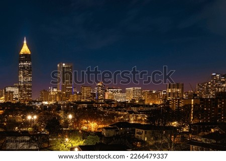Atlanta City Skyline at Night with Skyscrapers and Buildings at Cloudy Twilight over the Trees in Georgia Royalty-Free Stock Photo #2266479337