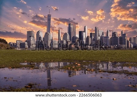 Amazing panoramic view of New York City skyline and skyscraper at sunset. Beautiful view of downtown Manhattan.