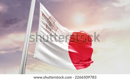 Malta national flag waving in the sky.