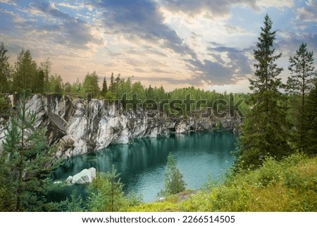 Beautiful landscape of cloudy sunset and cold blue mountain river