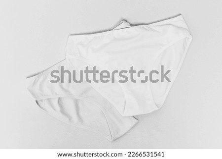 pair women's panties made of cotton close-up top view black and white photo Royalty-Free Stock Photo #2266531541