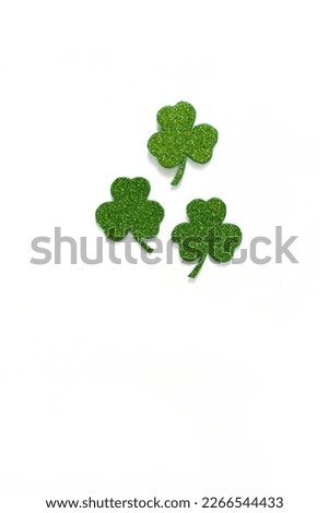 Happy St. Patrick's Day banner.Holiday background.St Patricks Day frame against a white background. Flat lay shamrocks.Copy space.Patrik's day banner Royalty-Free Stock Photo #2266544433