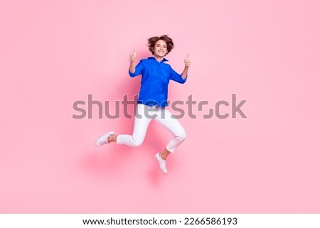 Full body size cadre of young jumping overjoyed entrepreneur business woman thumbs up enjoy new her new job isolated on pink color background