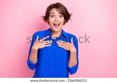 Portrait of impressed cheerful person arms touch chest open mouth isolated on pink color background