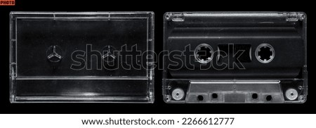 Clear cassette tape and cassette case set on isolated black background Royalty-Free Stock Photo #2266612777