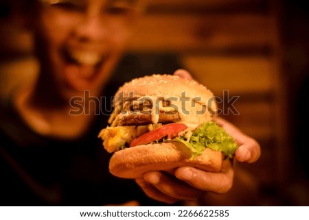 Photo of juicy and grilled hamburger.