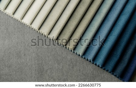 Bright collection of gunny textile samples. Multicolor fabric texture background. Samples of fabrics of different quality and category for furniture upholstery or curtains. Royalty-Free Stock Photo #2266630775