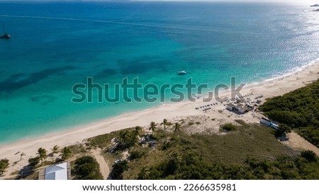 Rendezvous bay, Anguilla. Paradise beach on the British Caribbean Sea. Turquoise blue water with fine white sand. Beautiful sunny day with few clouds. Drone Top View. Royalty-Free Stock Photo #2266635981