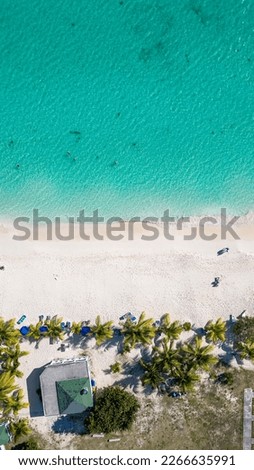 Rendezvous bay, Anguilla. Paradise beach on the British Caribbean Sea. Turquoise blue water with fine white sand. Beautiful sunny day with few clouds. Drone Top View. Royalty-Free Stock Photo #2266635991