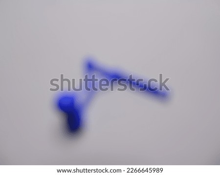 Defocused photo of a Lato Lato toy on a white background
