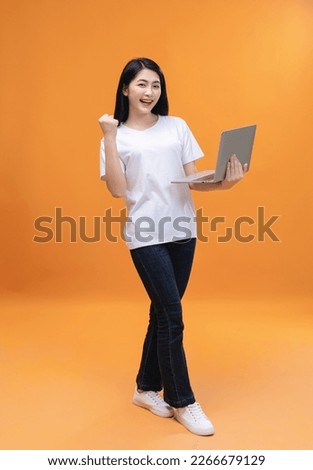Young Asian girl using laptop on back ground
