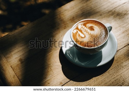 beautiful latte art coffee in white cup