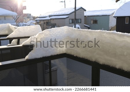 Sendai, Miyagi, Japan, February 2023.Snow piled up on the balcony of an apartment in winter.