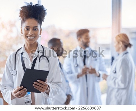 Black woman, doctor portrait and tablet with medical team in hospital ready for healthcare work. Wellness, health and medic employee in a clinic feeling happiness and success with blurred background Royalty-Free Stock Photo #2266689837