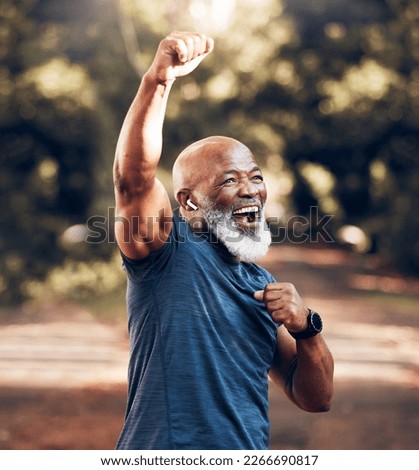 Park, success and running, winning black man excited and celebration at fitness run in nature with earphones. Music, workout and mature runner with smile and happy to celebrate exercise achievement.