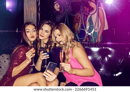 Club selfie, drinks and women at a disco party, new years memory and birthday celebration at a dark techno rave. Happy hour, event and friends at a night club with phone photo for social media
