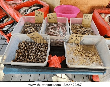Pictures of sea produces being sold in a wet market.