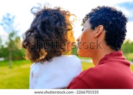 multicultural race enjoy father carrying little african girl child smiling in summer park