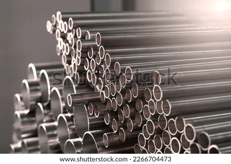 Stainless steel pipes in an industrial warehouse Royalty-Free Stock Photo #2266704473