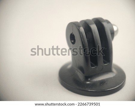 a holder or holder for an action camera, black in color, made of water- and heat-resistant plastic, without a locally made brand