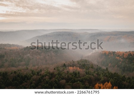 Aerial view of Ojcow Castle, ruins of gothic castle in Ojcow National Park. Trail of the Eagles' Nests and foggy landscape in autumn, Kraków-Częstochowa Upland, Poland, Europe. Royalty-Free Stock Photo #2266761795