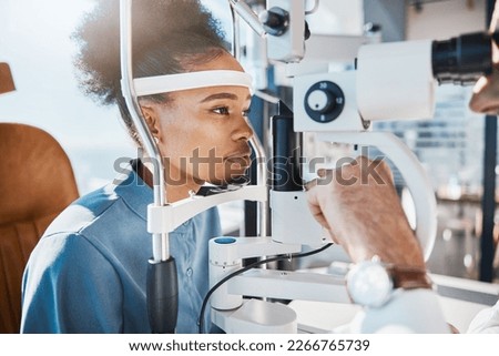 Eye exam or black woman consulting doctor for eyesight at optometrist or ophthalmologist. Face of African customer testing vision with optician helping or testing iris or retina visual health Royalty-Free Stock Photo #2266765739