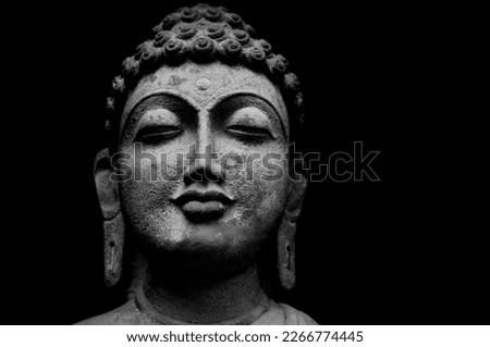 Buddha Face Statue Isolated On Black Background, Granite Buddha Statue Portrait.
