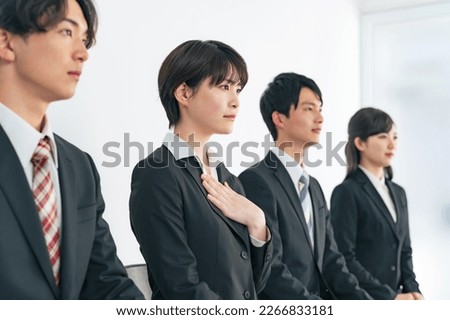 Asian group of young men and women undergoing group interview. job hunting.